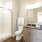 Well-lit bathroom with standing shower